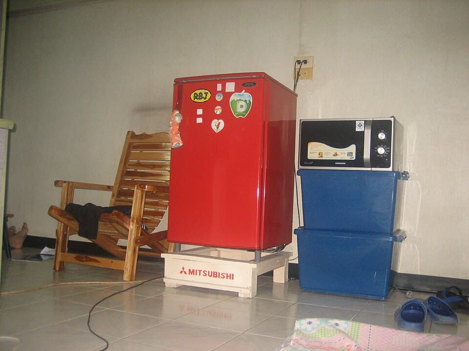 Workplace kitchenette with refrigerator and microwave stack