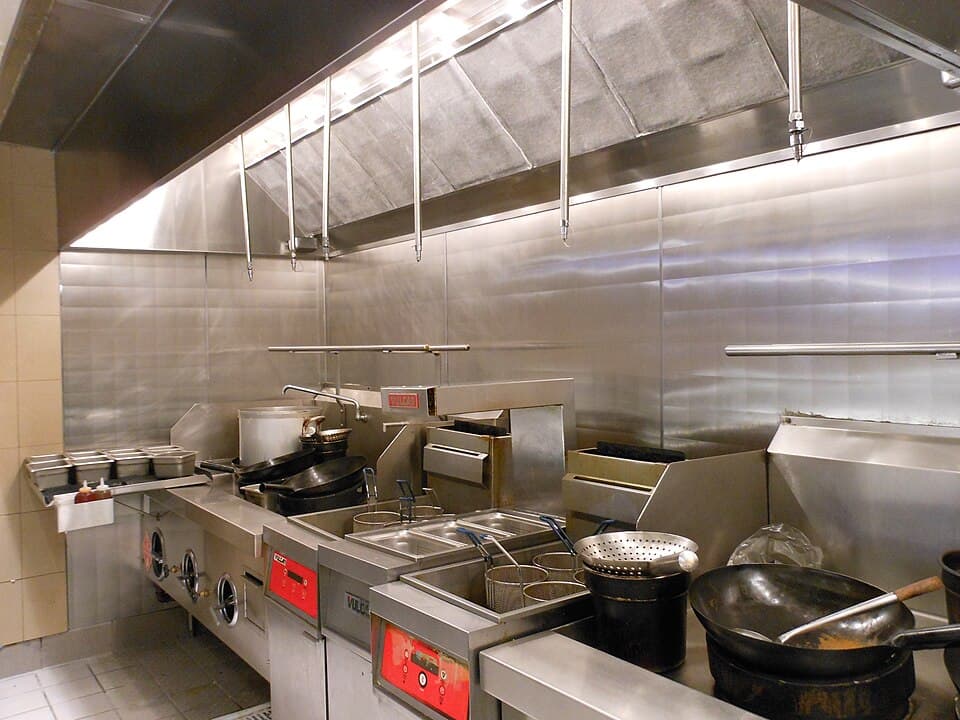 Commercial grease lock filters installed above cooking line